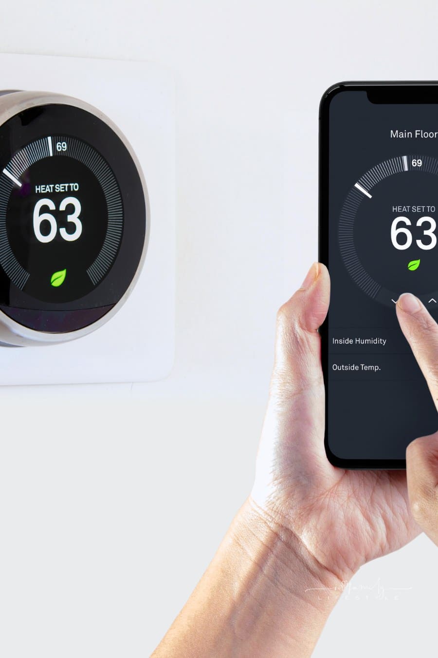 A person using a smart phone application saving energy with a wireless smart thermostat on a white background.