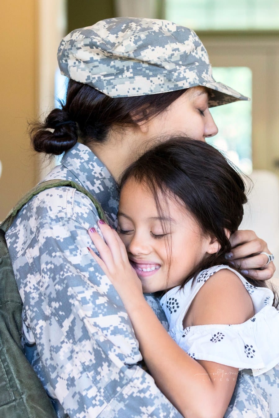 Young girl is happy to see military mom after deployment