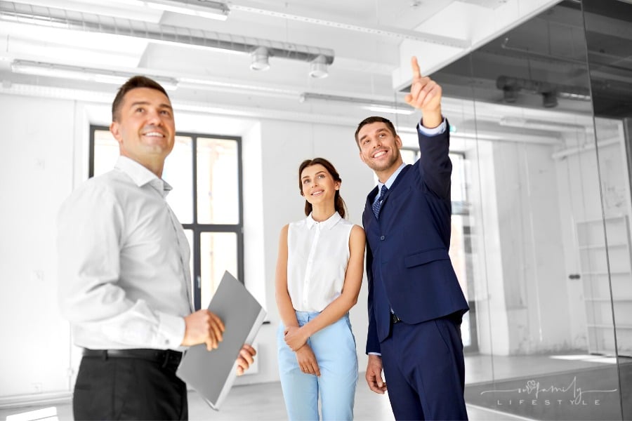 realtor showing property to couple