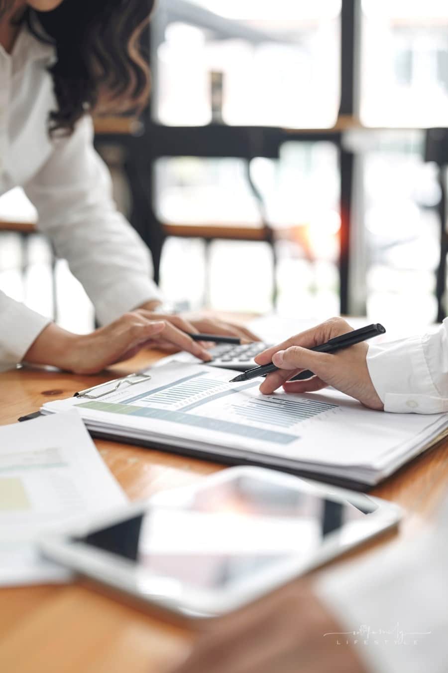 two business women analyzing data