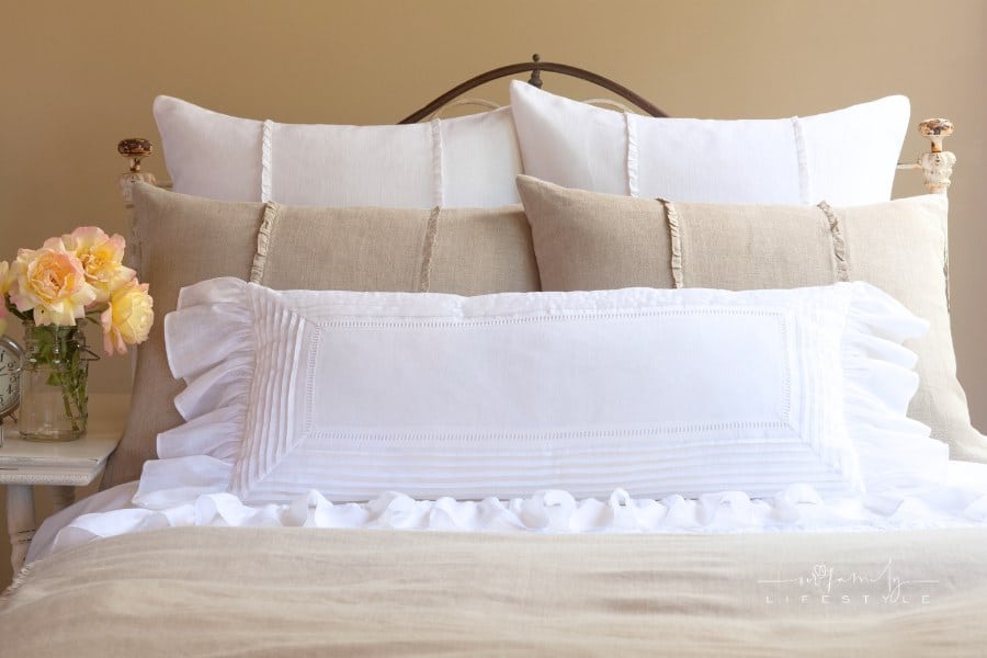 beige and white linen bedding