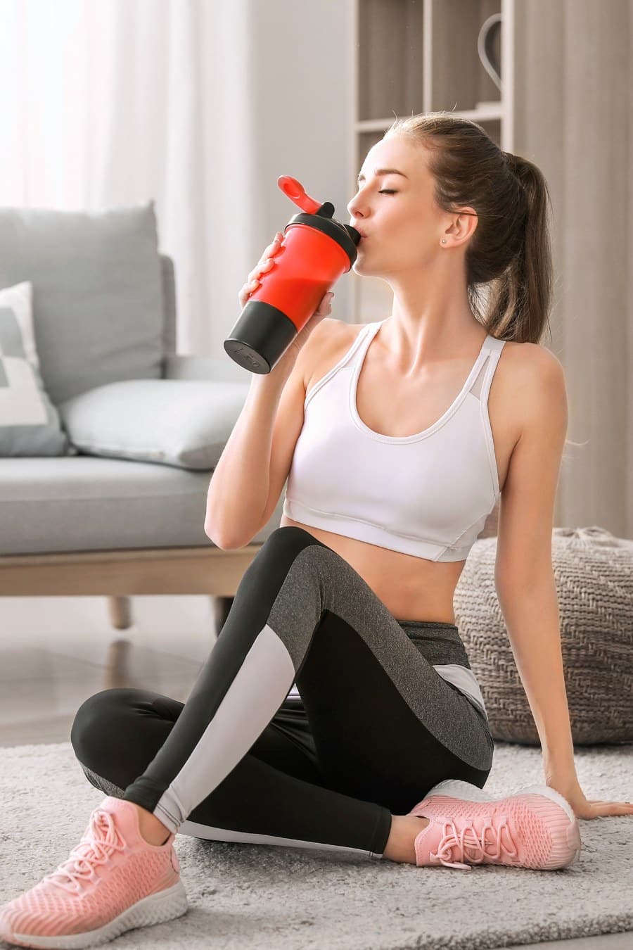Sporty Young Woman with Protein Shake