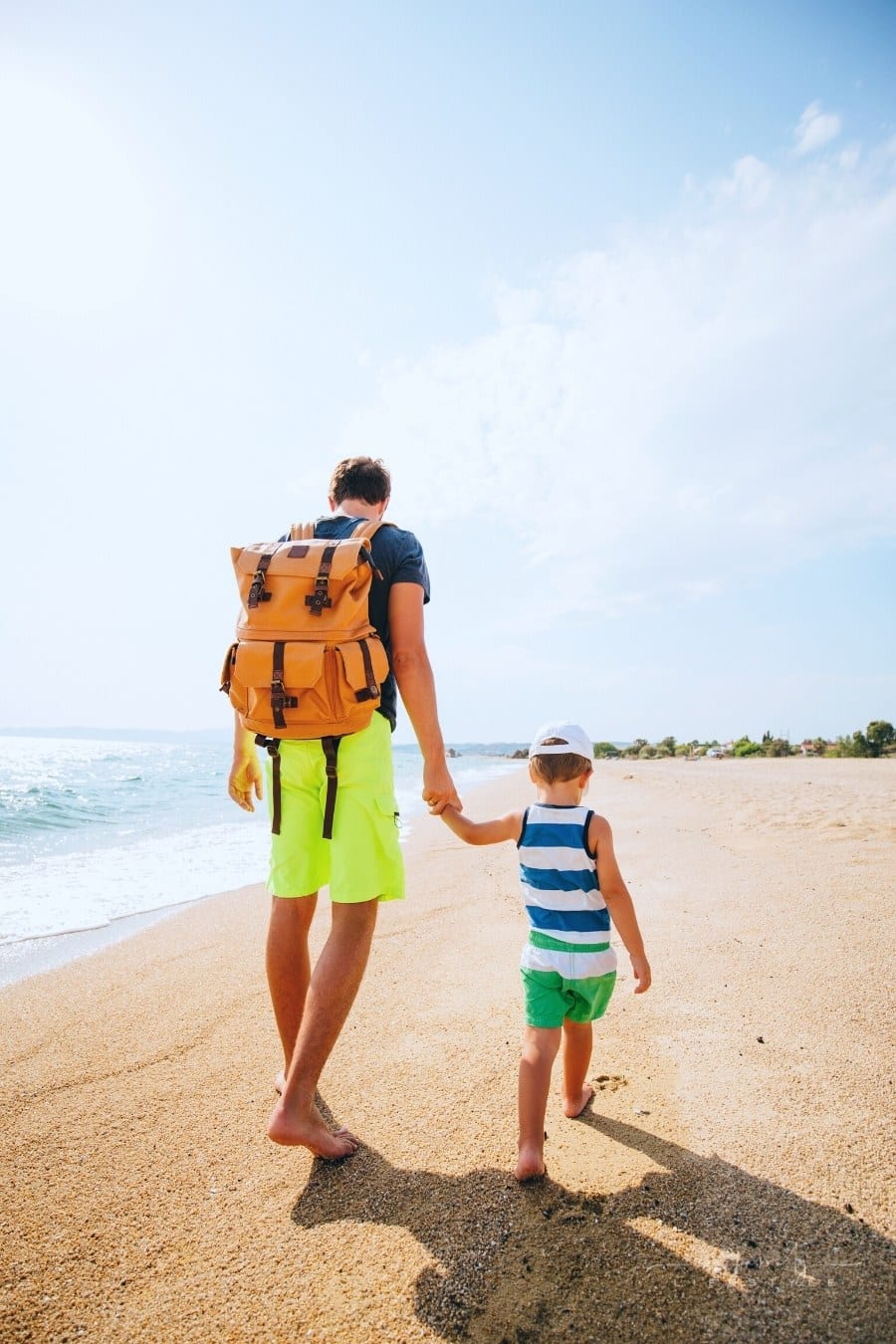 father and son exploring the beach together