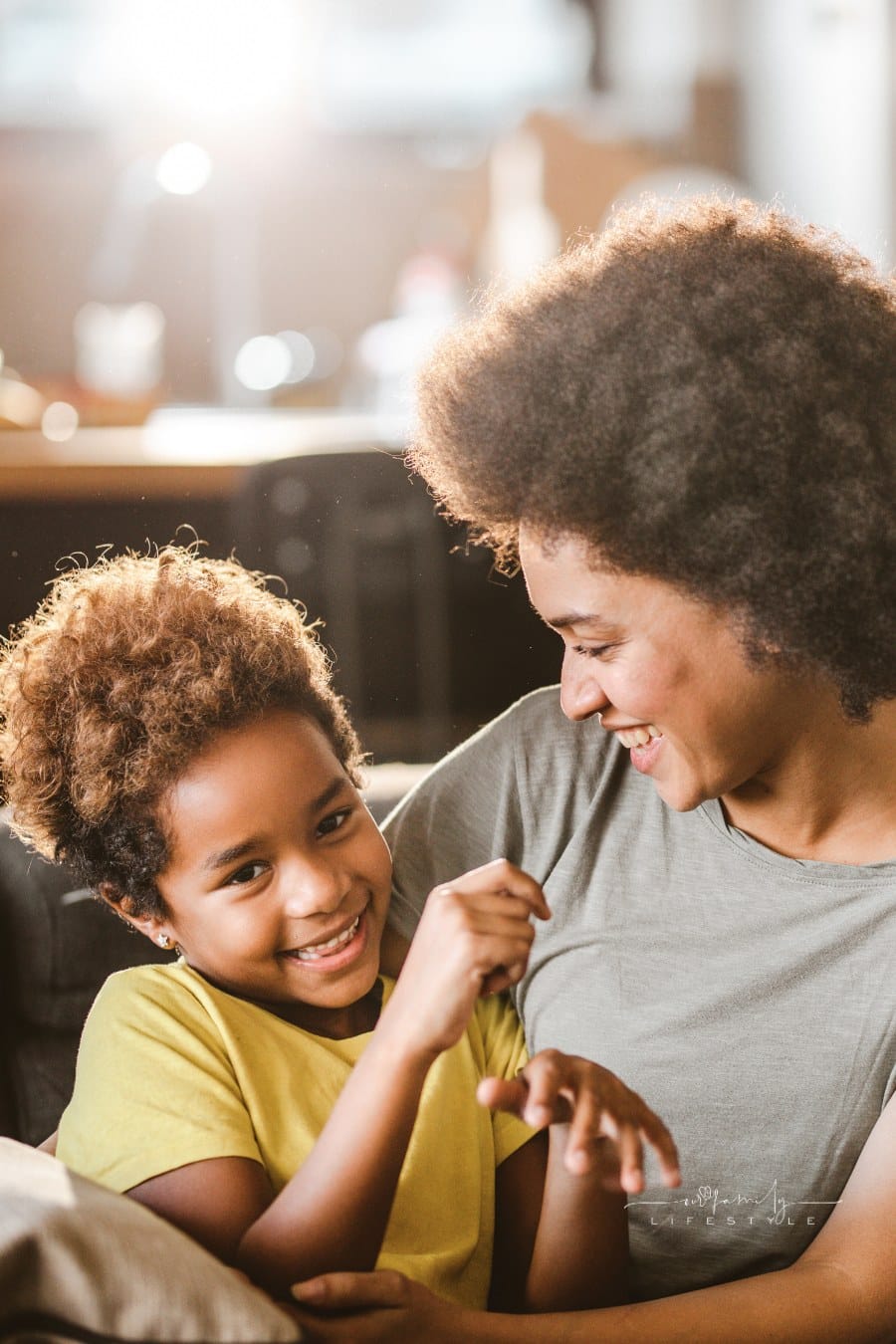 Cheerful African American family having fun in the living room.