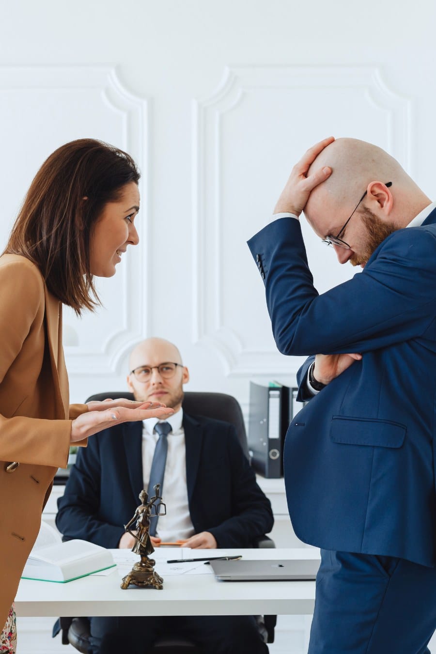 A Couple Discussing in Front of a Mediation Lawyer