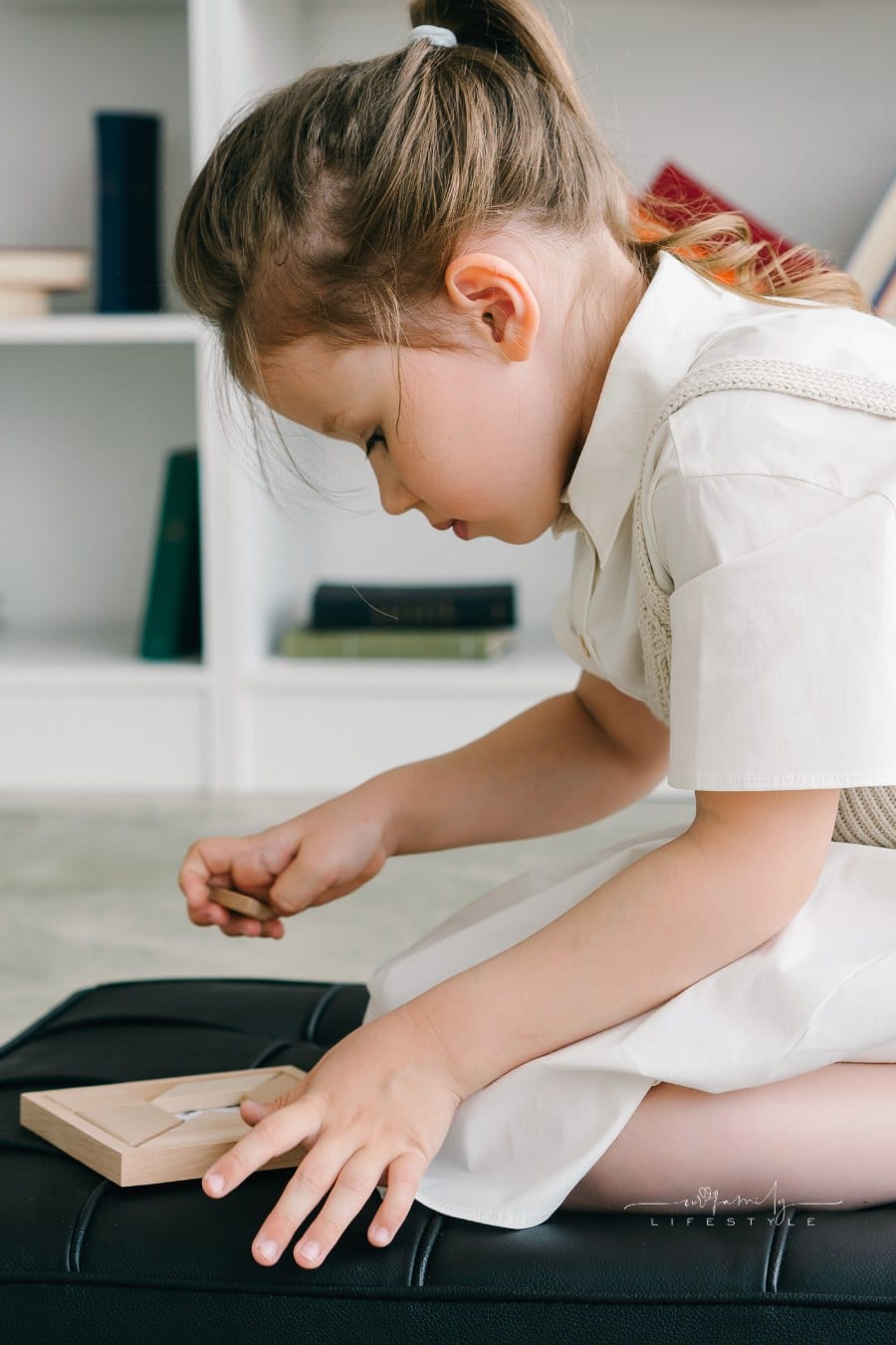 man observing child as they work through psychological evalutaion