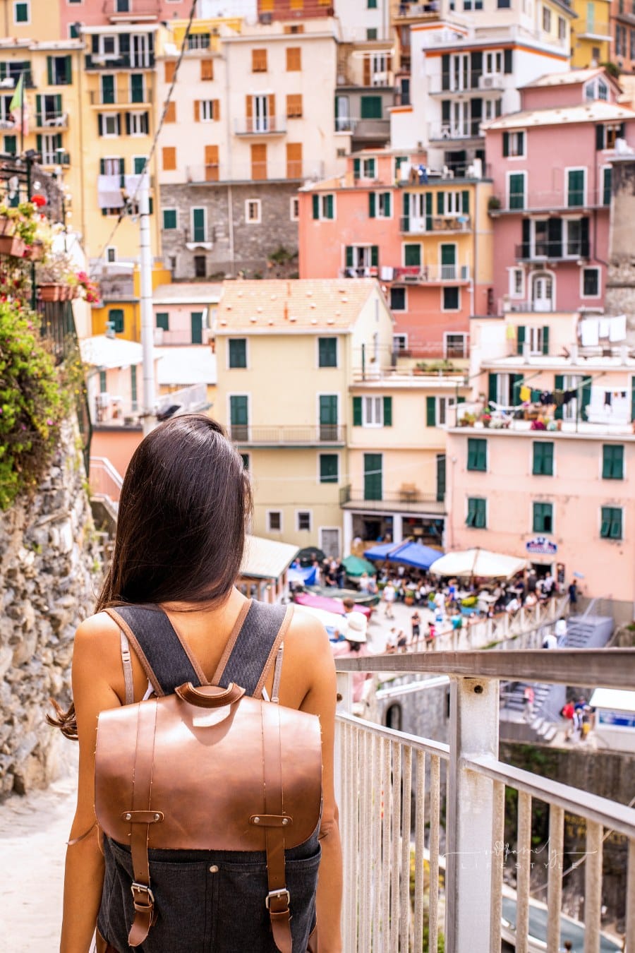 Female tourist visiting Riomaggiore. Beautiful town in Cinque Terre coast