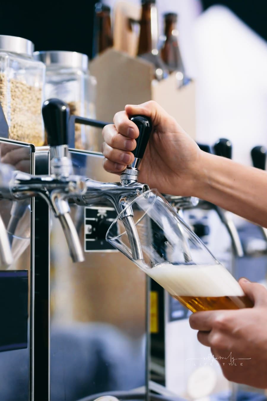 bartender pouring craft beer from tap