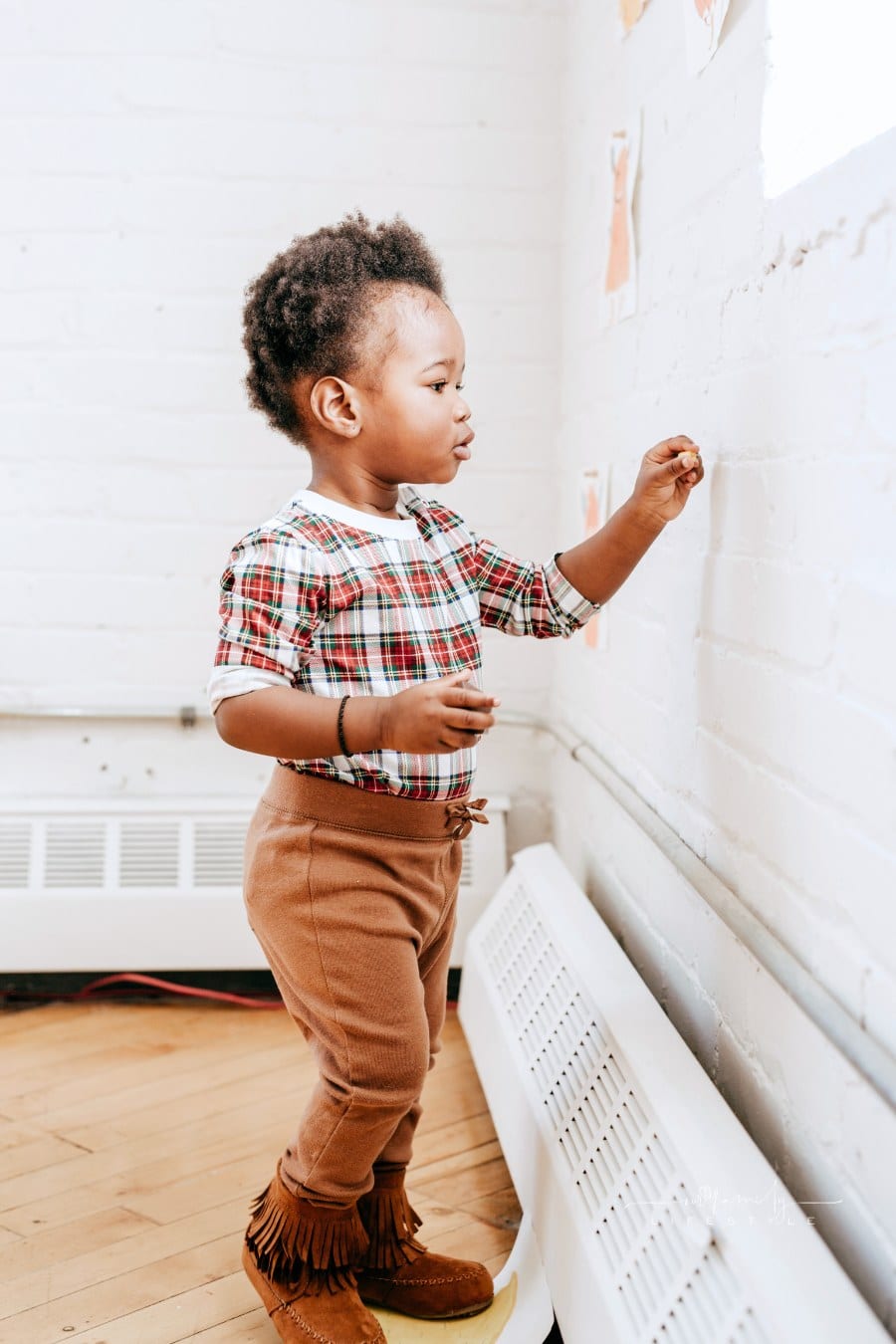 Educational activities for toddler wearing mixed patterns and textures, toddler fashion