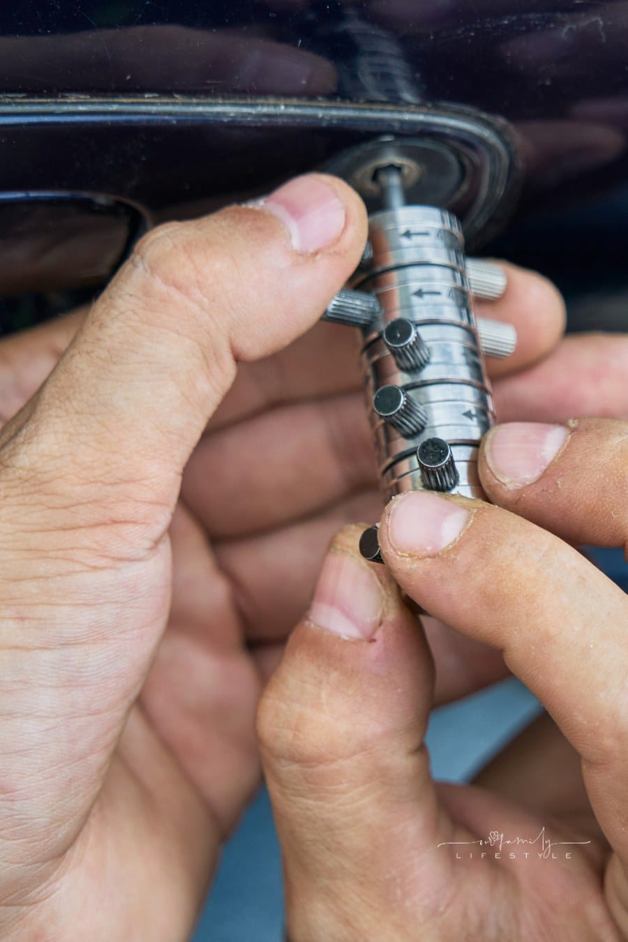 Locksmith Opening a Car Door with a Lock Picker