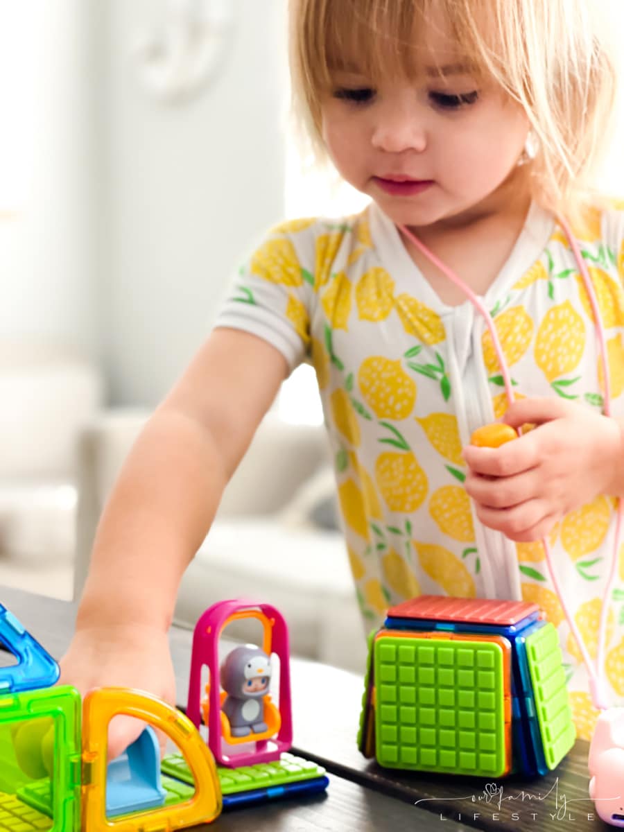 toddler playing with MAGFORMERS CUBE HOUSE PENGUIN SET