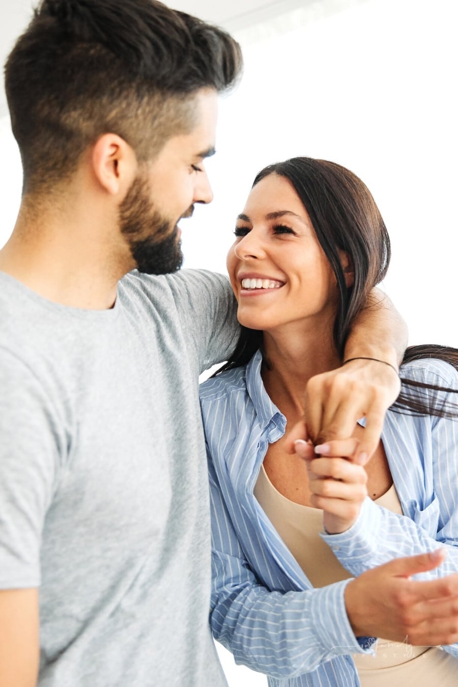young couple in love smiling at each other