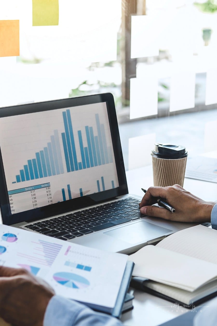 man working on financial documents