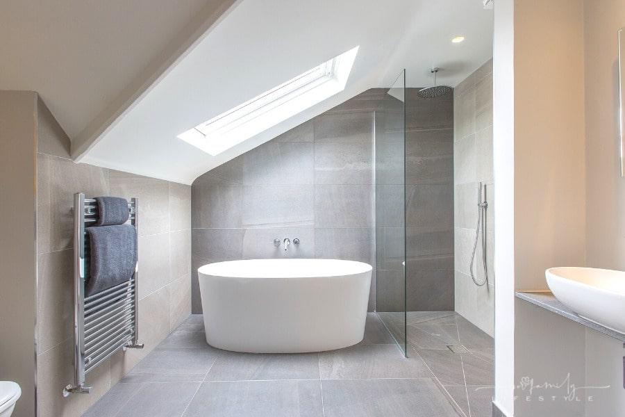 modern bathroom with skylight over bathtub