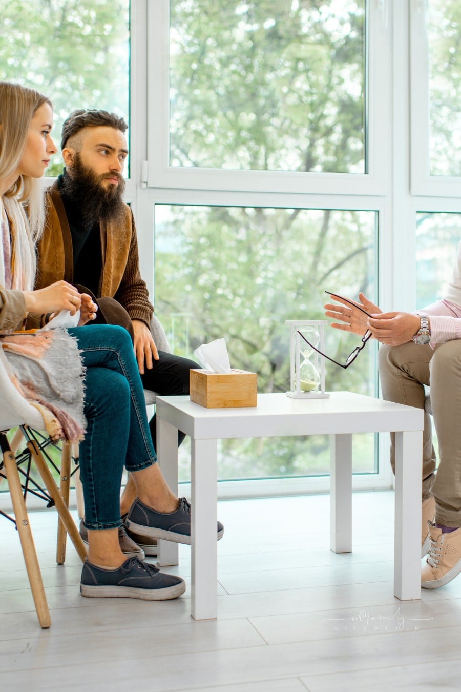 Couple Sitting with Psychologist during Therapy session