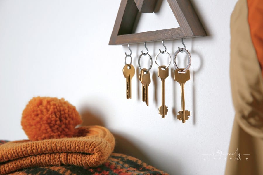 Wooden Key Holder on Light Wall Indoors