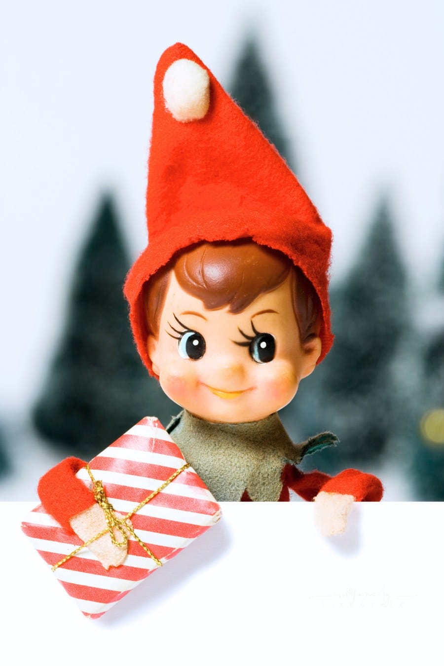 Small ornamental Christmas elf wearing red hat
