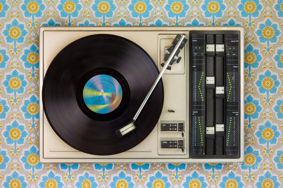 Vintage Record Player on Top of Flower Wallpaper