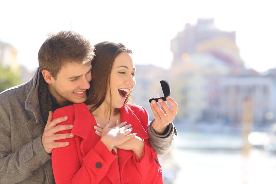 man proposing with diamond ring