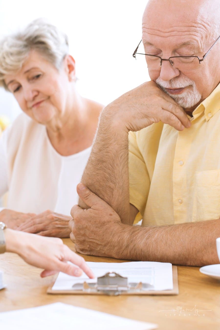 elderly couple reading life insurance contract