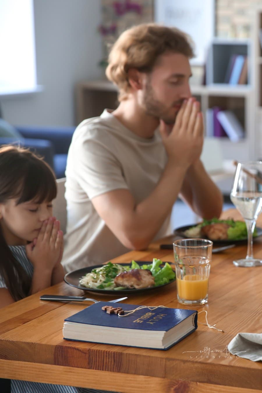 Family Praying before Meal at Home