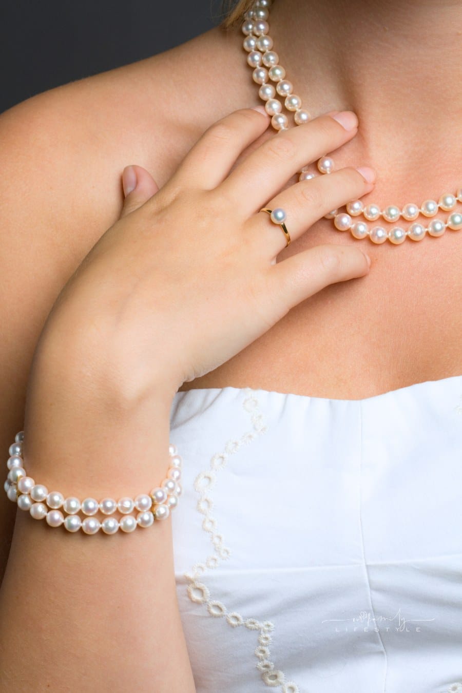close-up of woman wearing pearl jewelry