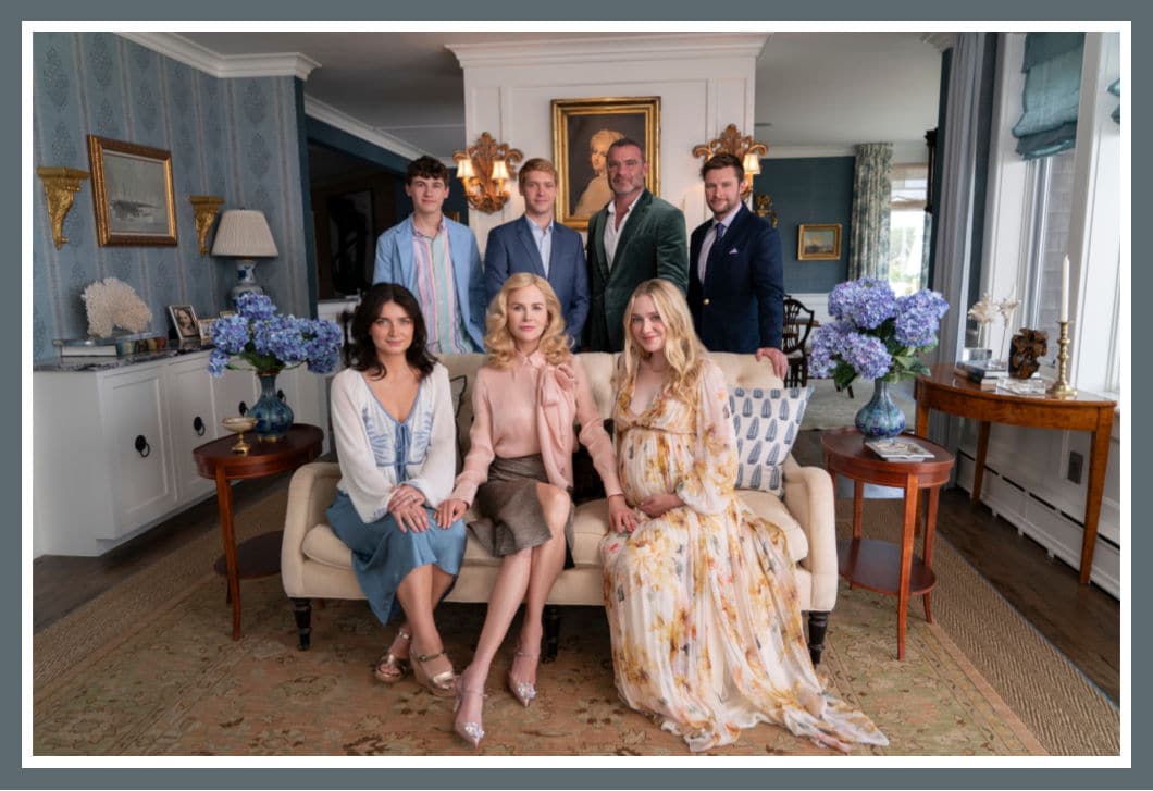 Cast of Netflix's series The Perfect Couple, featuring an ensemble of elegantly dressed characters in a sophisticated living room setting. This dynamic cast adds to the intrigue and drama, making the series a must-watch.