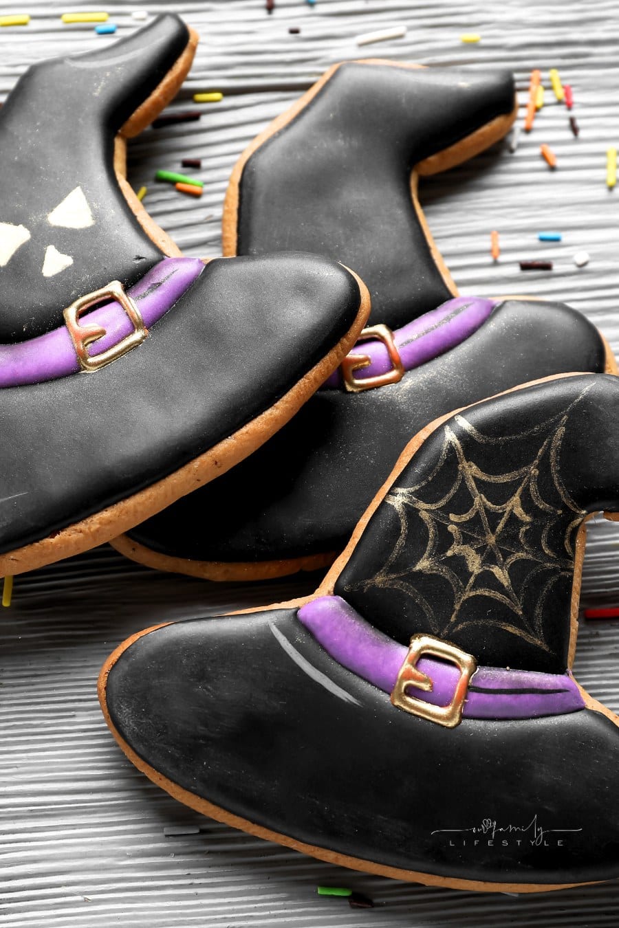 Halloween Witch Hat Cookies with Sprinkles on Grey Wooden Background, Closeup
