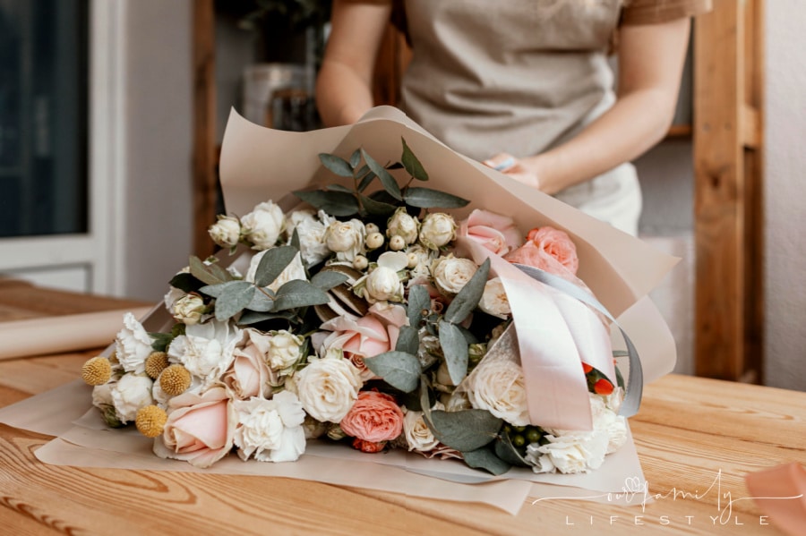 woman-making-pretty-pastel-floral-arrangement