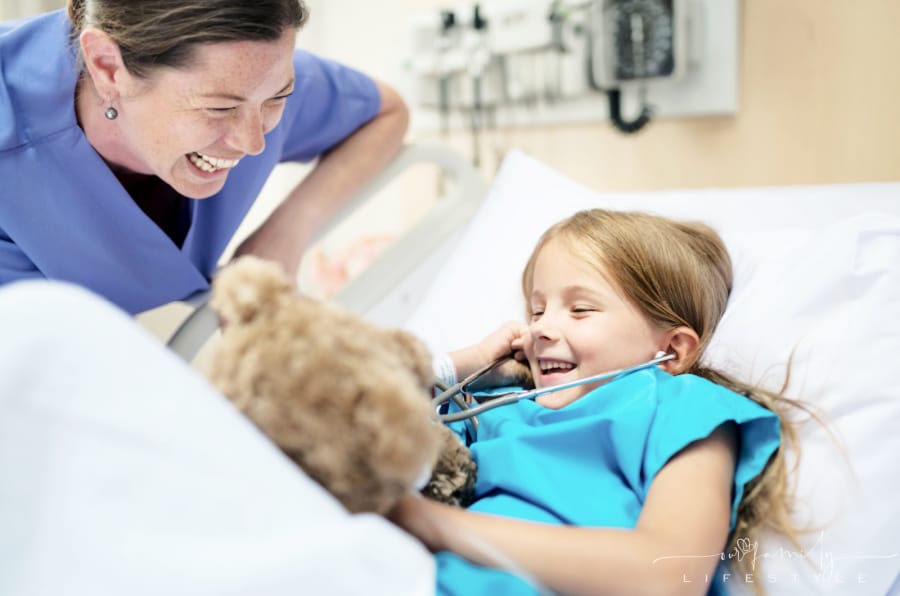 young-sick-girl-staying-hospital-nurse-bedside