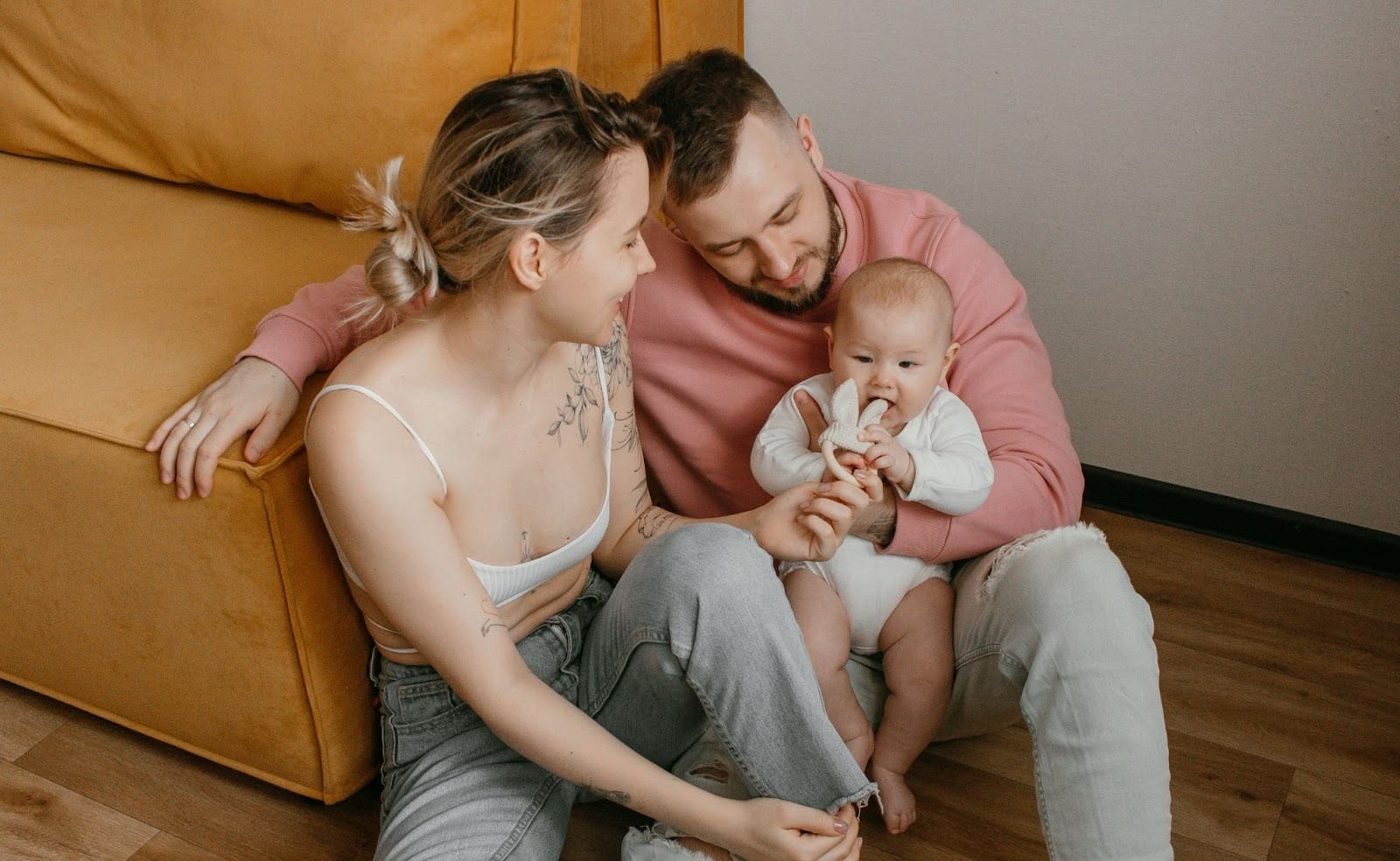 Parents with their baby at home.