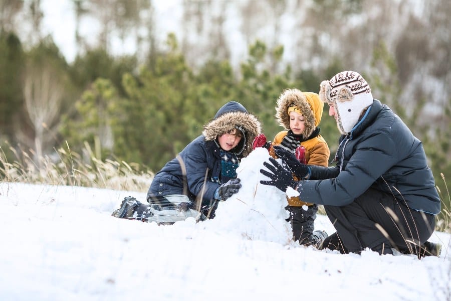 Family making snowman