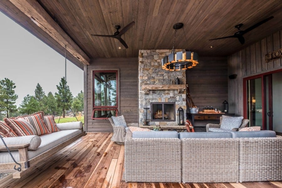 Porch swing under covered patio on a rainy day
