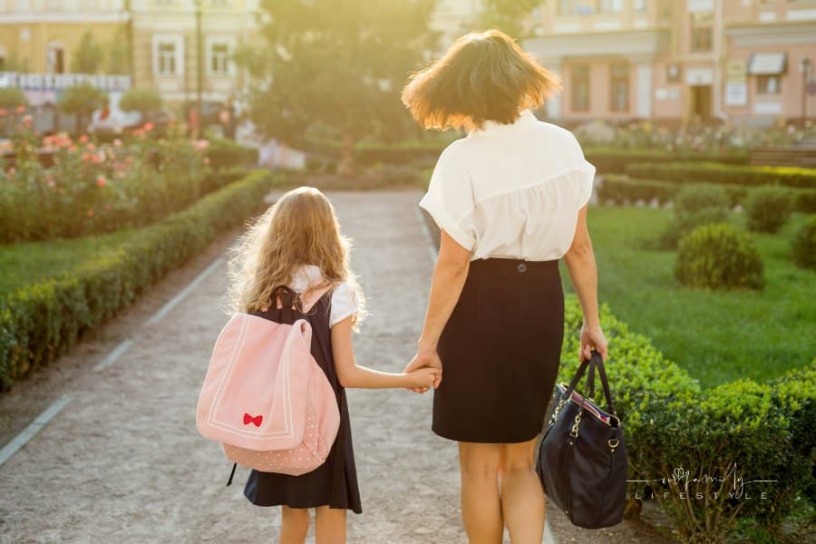 Mother Taking Daughter to School