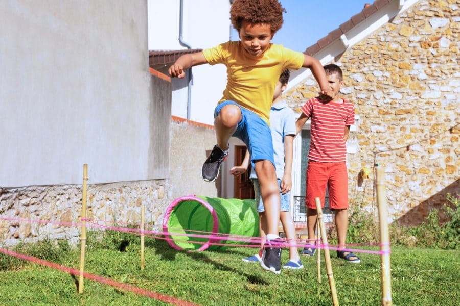 Race with Obstacles Children Jump over Barrier