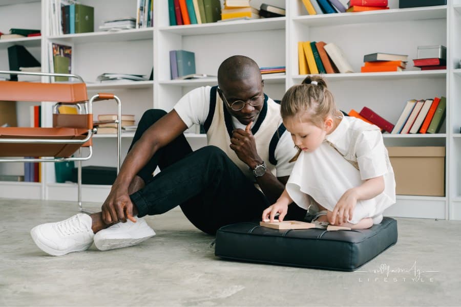 man observing child as they work through psychological evalutaion