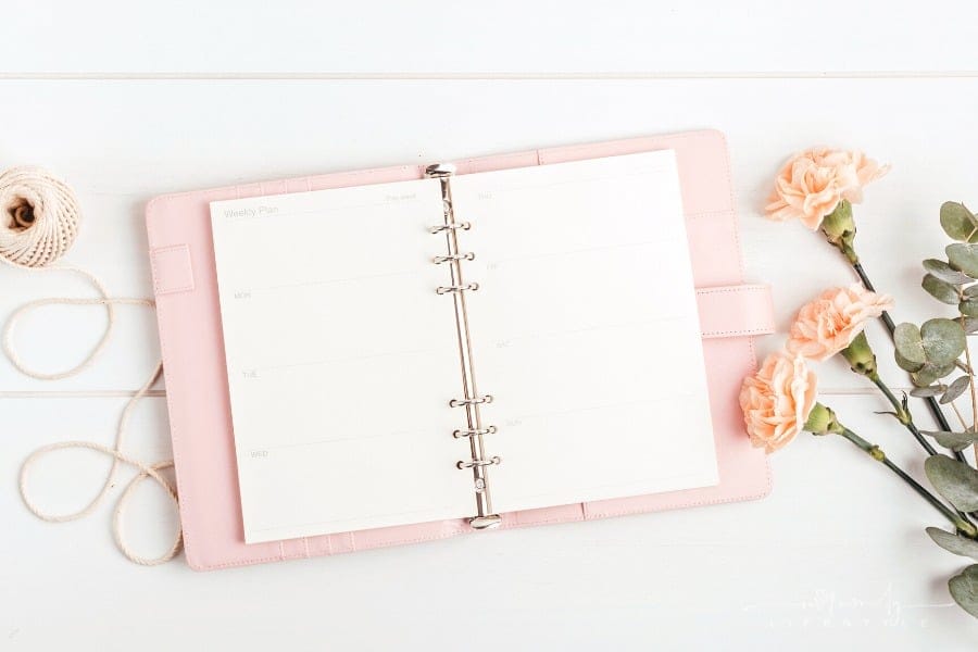 open pink planner with flowers