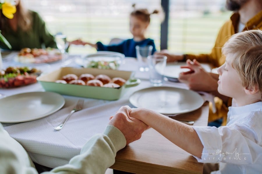 Close-up of Holding Hands, Praying before Easter Lunch.