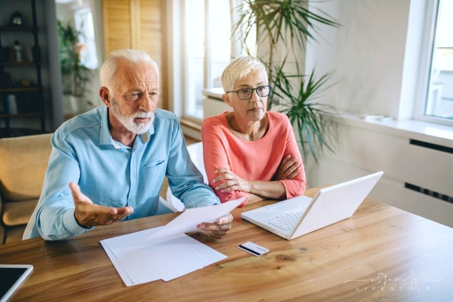 senior couple trying to figure out finances together