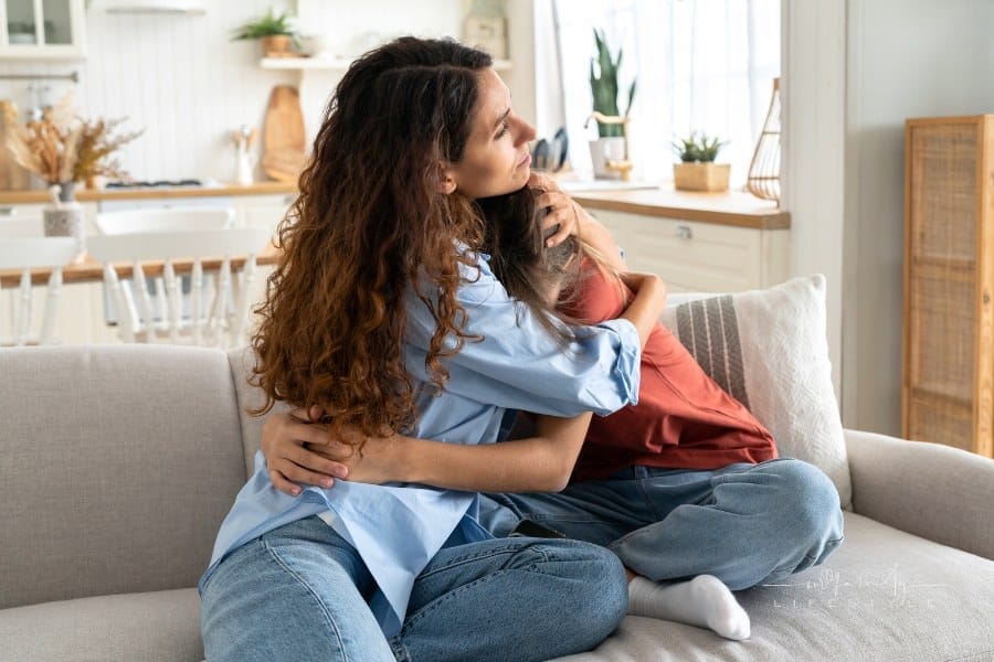 Loving Mother Comforting Hugging Unhappy Teenage Daughter, Mom Supporting Depressed Teen Girl Child