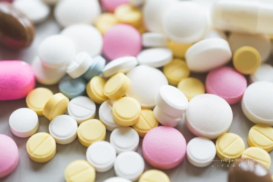 Antidepressant pills of different colors close up