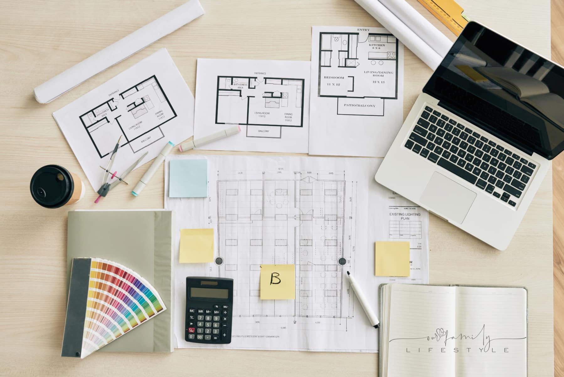 Plans and blueprints on table of interior designer, view from above