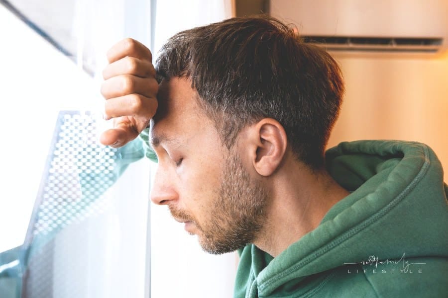 Midlife crisis in men concept. Tired depressed man portrait looking at window with frustrated eyes. Burnout, life problems an