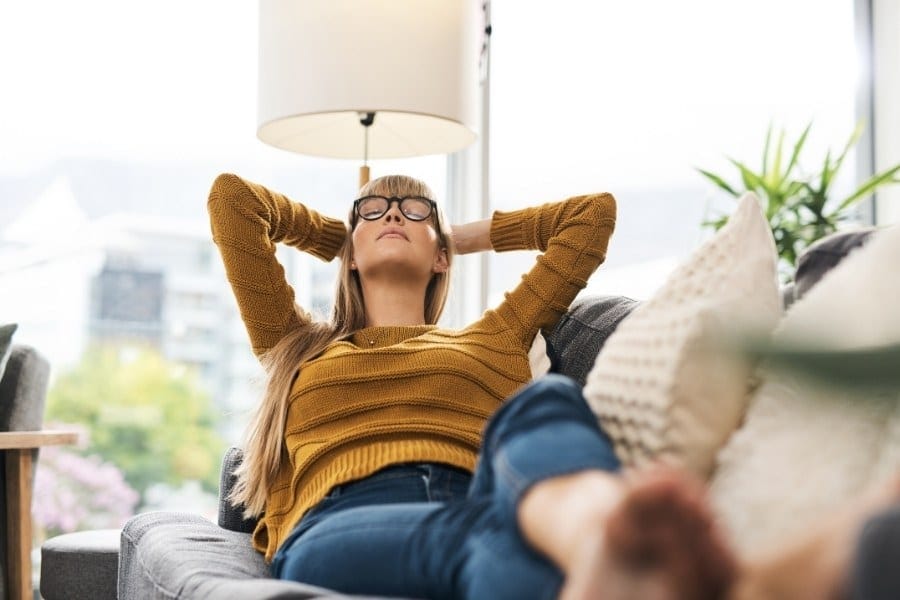 Shot of a young woman relaxing on the sofa at home