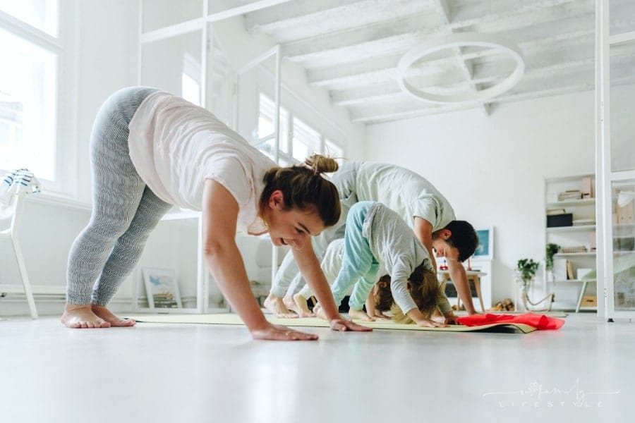 young family doing yoga
