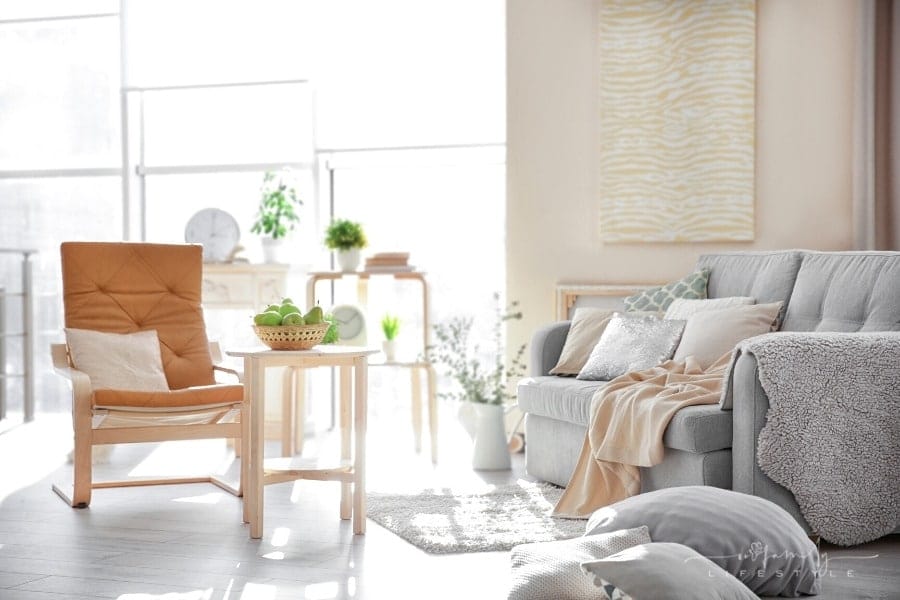 modern interior of cozy grey and peach living room