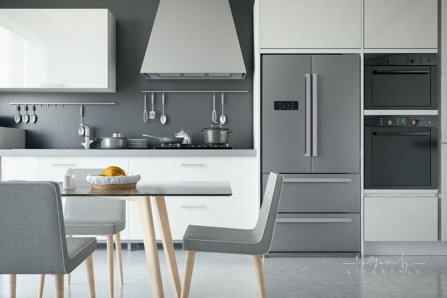 modern grey and white kitchen with stainless steel appliances