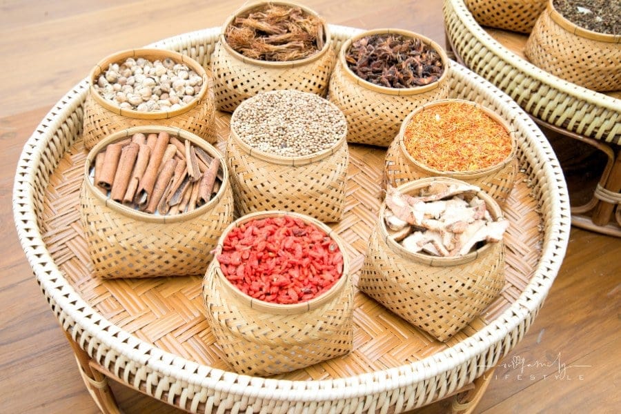 dried herbs and spices in wicker baskets