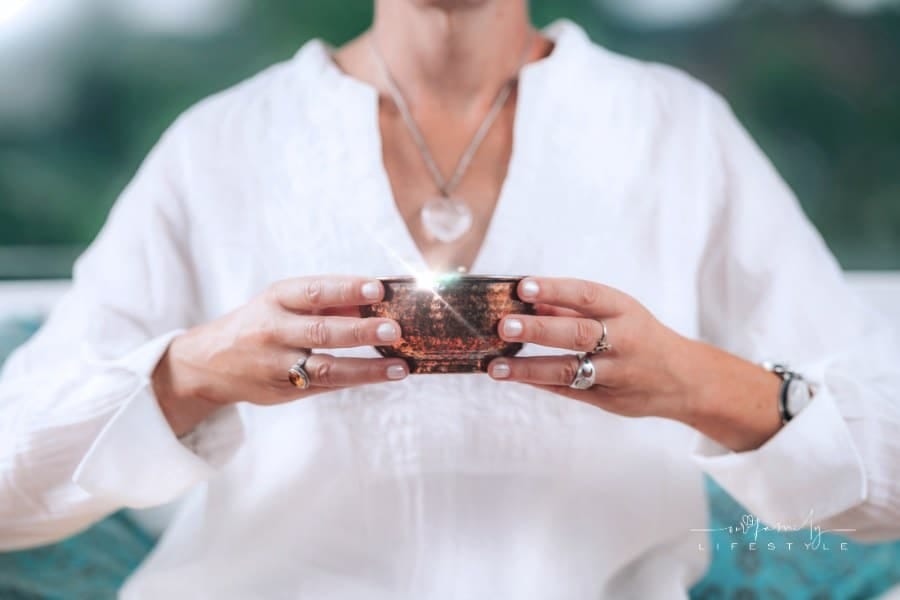 Woman Partaking in a Tea Drinking Ritual