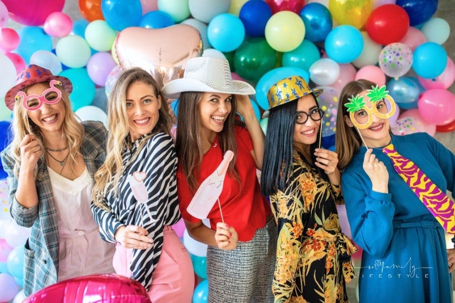 Birthday party with photo booth props and balloons